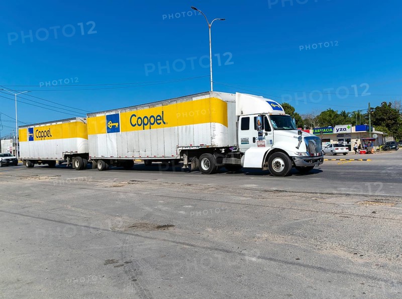 Vehicles road traffic on highway 307, Bacalar, Quintana Roo, Mexico Coppel articulated truck