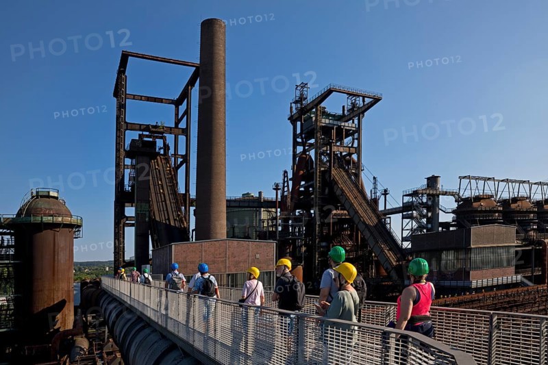 Group on the skywalk with a view of the blast furnaces, former Phoenix West industrial plant, Dortmund, Ruhr region, North Rhine-Westphalia, Germany, Europe