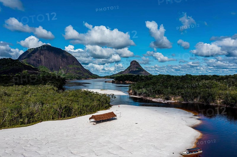 Black river and white sand beach before the granite hills, Cerros de Mavecure, Eastern Colombia