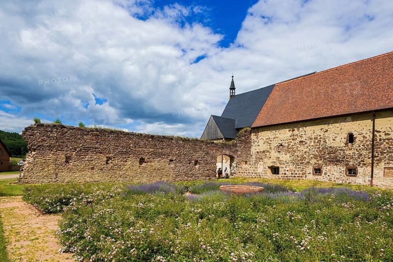 DEU Saxony Klosterbuch Area of the former cloister with Romanesque fountain bowl in the Kreugarten Buch Monastery is a former Cistercian monastery founded as St. Mary's Monastery in the 12th century. After the Reformation, it and its lands became a purely agricultural enterprise