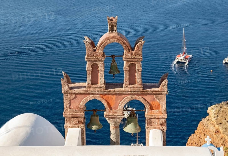 Old belfry wiith yacht and blue sea, Ia, Oia, Santorini, Greece, Europe