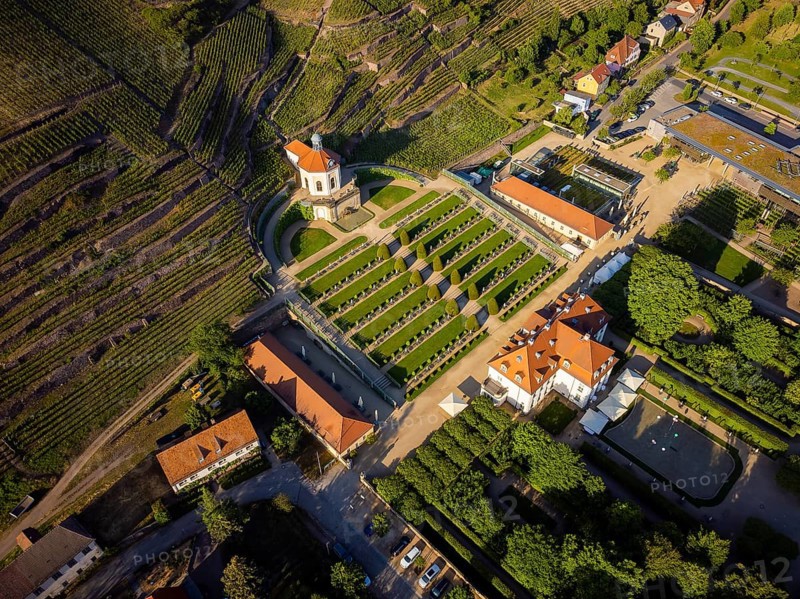 Wackerbarth Castle, originally Wackerbarths Ruh', is a Baroque castle surrounded by vineyards in the Radebeul district of Niederlössnitz on the road to Meissen, which serves as the seat of the Saxon State Winery. The winery belongs to the single vineyard Radebeuler Johannisberg within the large vineyard Lössnitz and is located in the listed historical vineyard landscape Radebeul
