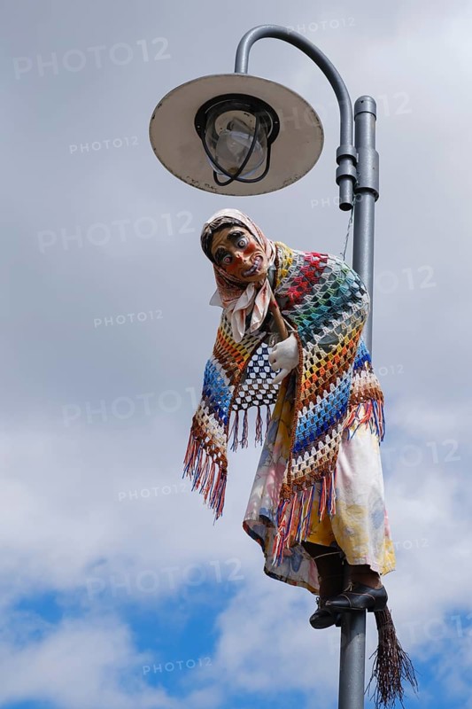 Figure of a witch hanging from a streetlamp, Walpurgis Night, St. Andreasberg, Lower Saxony, Germany, Europe