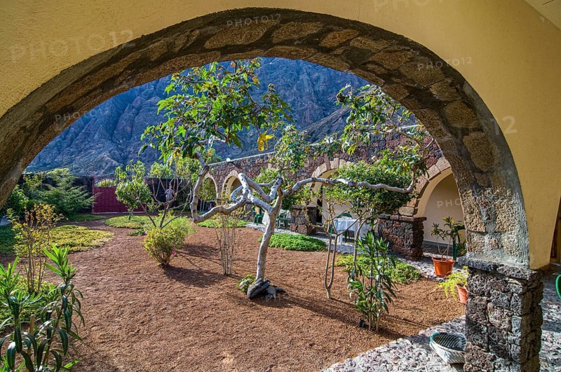 Inner yard of stone house, view through arch. Fogo. Cabo Verde. Africa