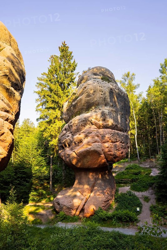 The Kelchstein is a mushroom rock in the Zittau Mountains near Oybin in Saxony and is part of the Kelchsteine natural monument. The Kelchstein is made of chalk sandstone, which is quite poor in binders. Its unusual mushroom shape is due to the effect of wind abrasion and erosion on the various hard sandstone layers