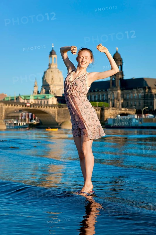 Young woman on the Elbe meadows in Dresden