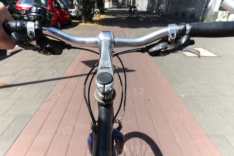 Cycling from a first-person perspective on a cycle path in Cologne, North Rhine-Westphalia, Germany, Europe