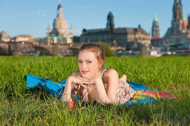 Young woman on the Elbe meadows in Dresden