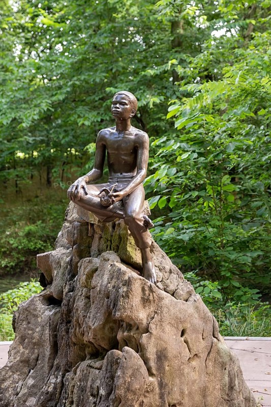 Diamond, Missouri, The Boy Carver statue, by sculptor Robert Amendola, at George Washington Carver National Monument. The monument preserves the Moses and Susan Carver farm where Carver was born as a slave in about 1864. It was the first National Monument to honor an African-American