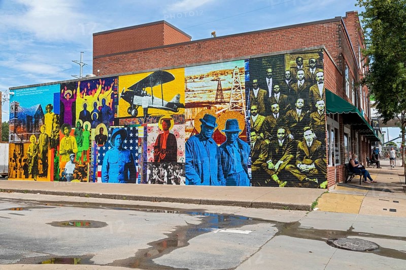 Tulsa, Oklahoma, History in the Making, a wall painting by artist Skip Hill, depicts residents of the Greenwood District, known as the Black Wall Street. The district was burned to the ground with many African-Americans killed in the 1921 Tulsa race massacre