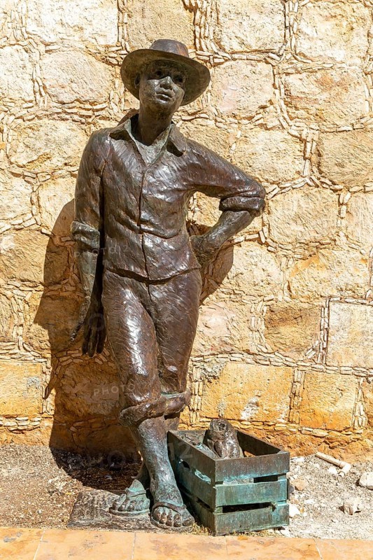 Bronze sculpture statue of a fisherman by city wall Campeche, Campeche State, Mexico, Central America