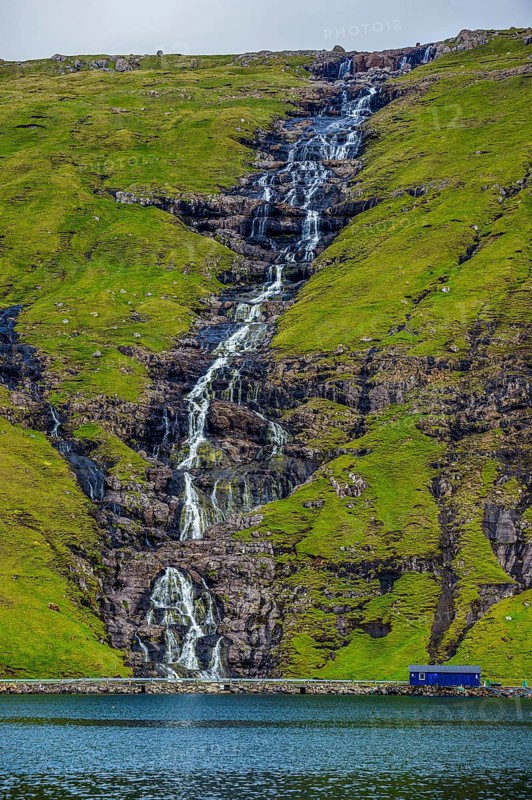 Waterfall tumbling down the hill, Streymoy, Faroe islands, Denmark, Europe