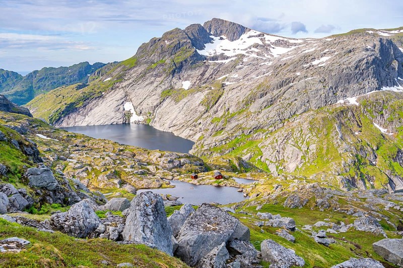 Mountain landscape with Munkebu mountain hut and small lakes, in the back lake Fjerddalsvatnet, view from the ascent to Munken, Moskenesoya, Lofoten, Nordland, Norway, Europe