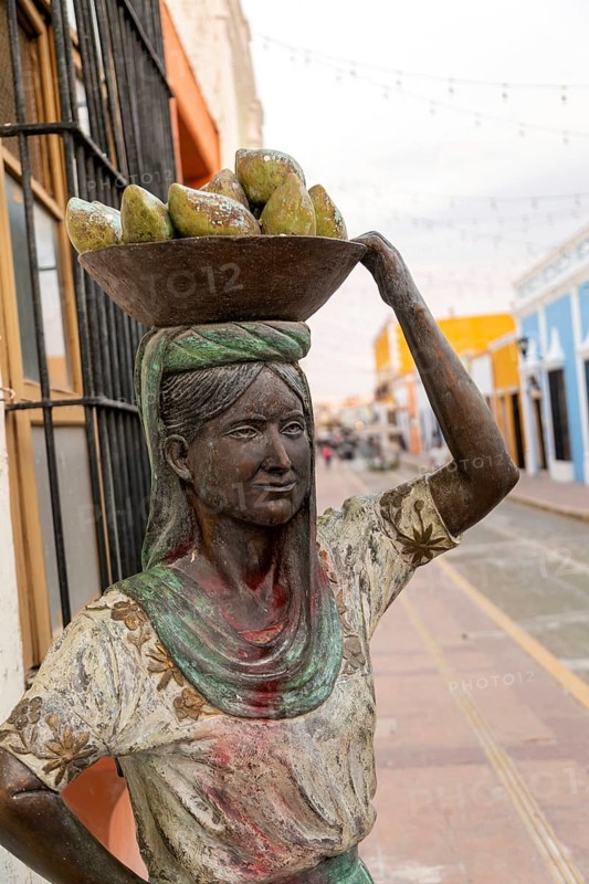 Sculpture statue of Mayan woman carrying bowl of fruit on her head, Campeche city, Campeche State, Mexico, Central America
