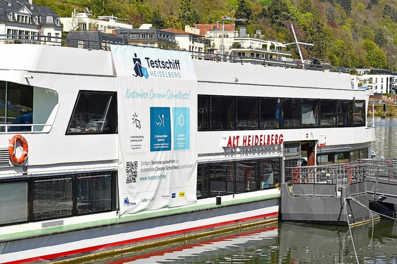 Heidelberg, Germany, April 2021: Corona virus test station called 'Testschiff' on boat offering free rapid antigen tests on Neckar river, Europe