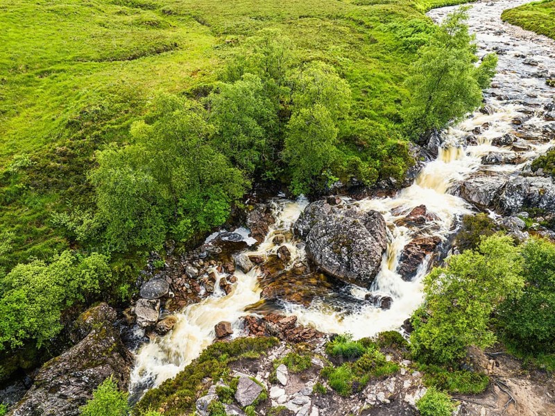 Waterfall on River Coupall from a drone, Buachaille Etive Mor, Glen Etive and River Etive, Highlands, Scotland, UK