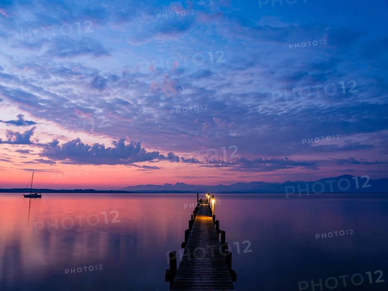 Sailing boat and jetty on Lake Chiemsee at dawn, behind the Chiemgau Alps, Chiemgau, Upper Bavaria, Bavaria, Germany, Europe
