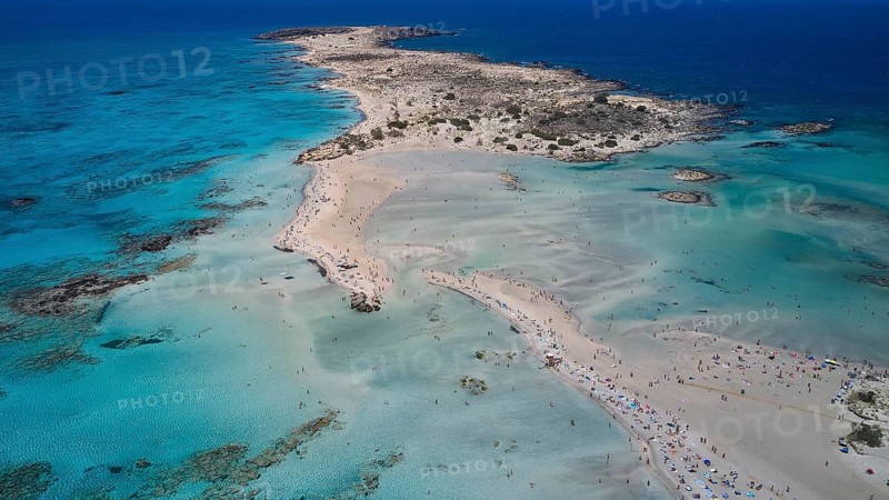 Overtourism, tourists on the beach, parasols, A peninsula with a sandy beach jutting out into the blue sea, a perfect holiday destination, Elafonissi, lagoon, south-western tip of Crete, Crete, Greek islands, Greece, Europe