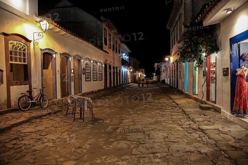 Atmospheric night view of illuminated street and buildings in historical center of Paraty, Brazil, Unesco World Heritage, South America