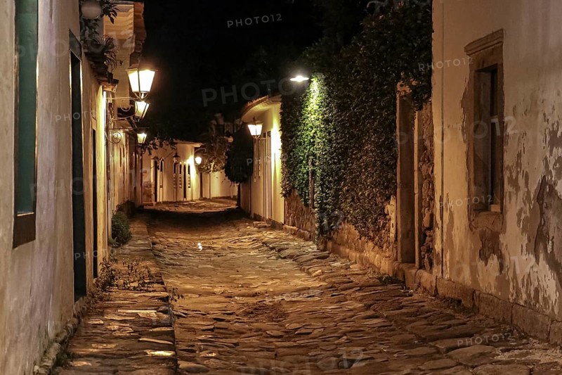 Atmospheric night view of illuminated street and buildings in historical center of Paraty, Brazil, Unesco World Heritage, South America