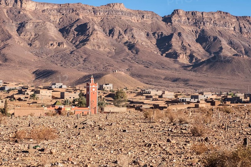 A semi deserted barbarian village in the atlas mountains surrounded by date palms along the road from marrakesh to the sahara desert.