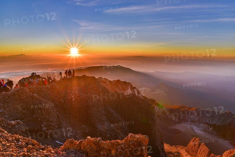 People on the summit of volcano Rinjani watching sunrise, Lombok, Indonesia, Asia