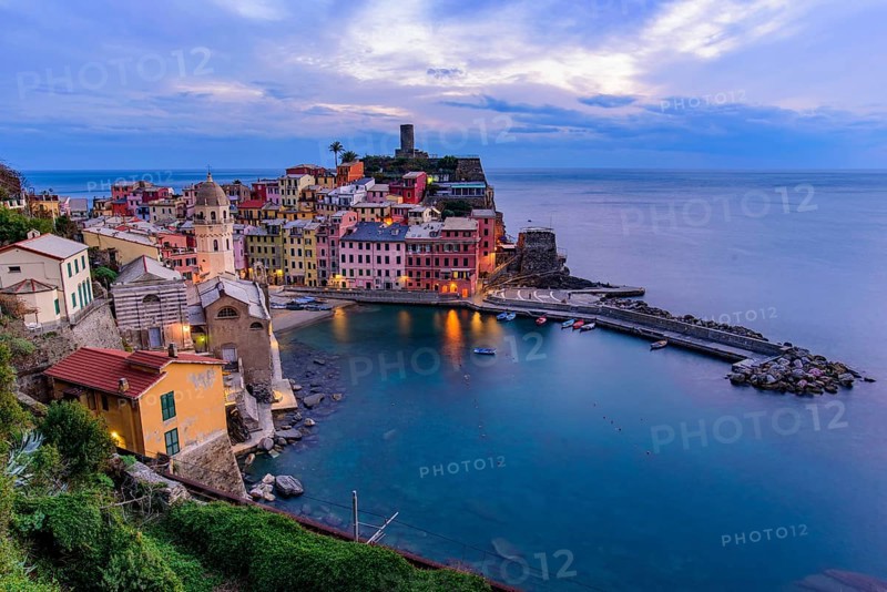 Sunset view of Vernazza, one of the five Mediterranean villages in Cinque Terre, Italy, famous for its colorful houses and harbor, Europe