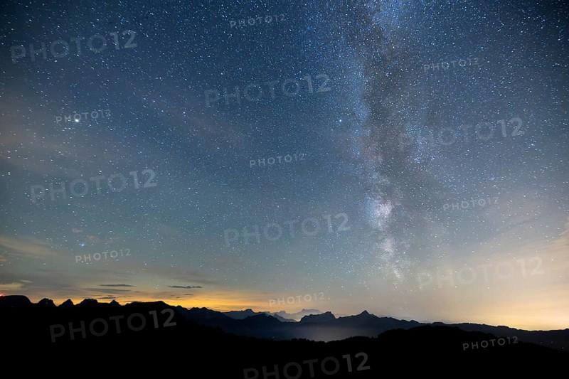 Clear starry sky with visible Milky Way and mountains in the background, Hochalp, Urnäsch, Appenzell Ausserrhoden, Switzerland, Europe