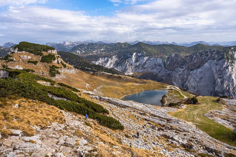 Lake Augstsee and the Atterkogel mountain on the Loser. View of other mountains. Autumn, good weather, blue sky and clouds. Altaussee, Bad Aussee, Ausseer Land, Totes Gebirge, Styria, Upper Austria, Austria, Europe