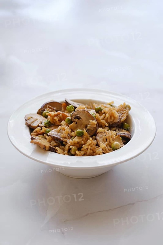 Rice with pork and champignon mushrooms