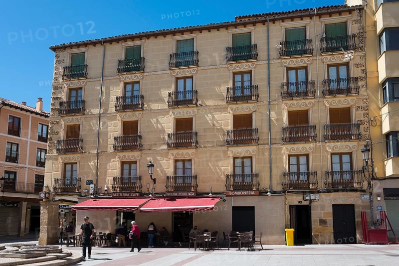 Historic building with balconies and shaded terrace, bright sunshine and clear sky, Plaza el Rosel, Soria, Castilla y León, Leon, Spain, Europe