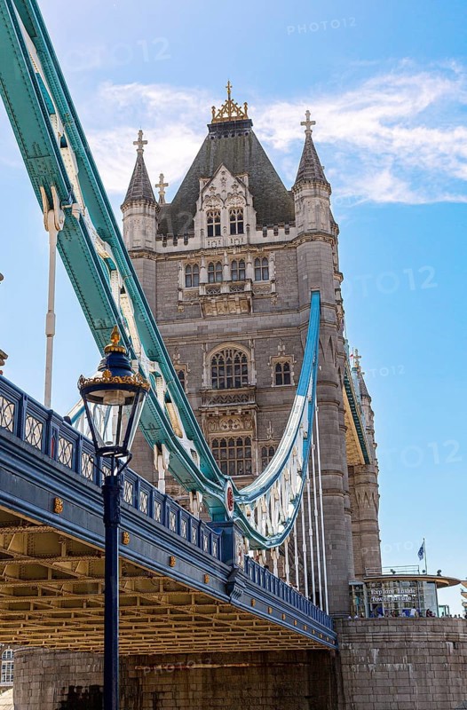 The historic Tower Bridge with towering structures and blue lower section under a clear sky, London, United Kingdom United Kingdom