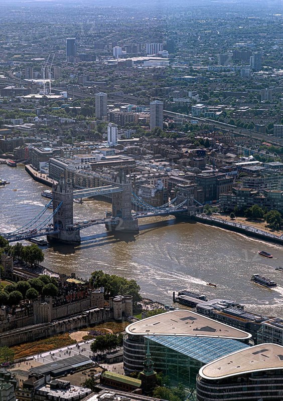 Aerial view of Tower Bridge and surrounding city buildings on a clear day, London, England, United Kingdom, Europe
