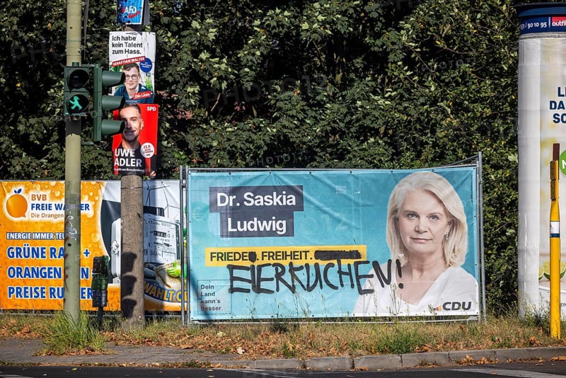 State election in Brandenburg 2024: parties advertise for votes on election posters. Peace, freedom and pancakes. Graffiti on an election poster for CDU candidate Saskia Ludwig. Potsdam, Brandenburg, Germany, Europe