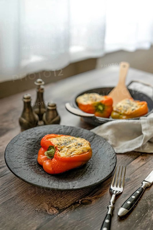 Roasted goat cheese stuffed bell peppers on a table
