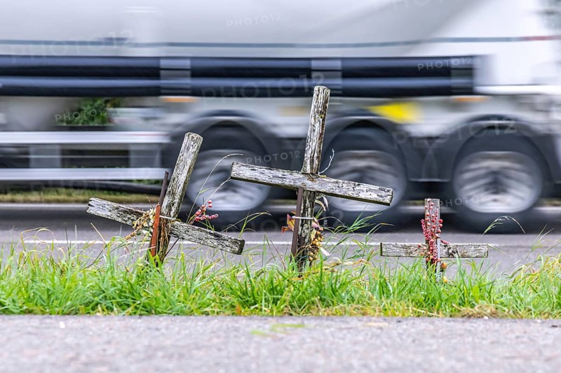 Cross on a country road, symbol of remembrance for three road accident victims. Laichigen, Baden-Württemberg, Germany, Europe