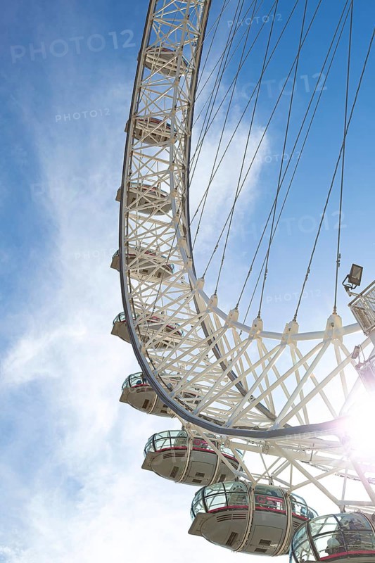 Detailed view of the London Eye Ferris wheel with metal structure and capsules under a blue sky, London, United Kingdom, Europe
