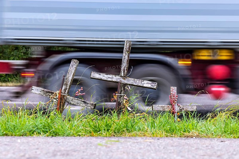 Cross on a country road, symbol of remembrance for three road accident victims. Laichigen, Baden-Württemberg, Germany, Europe