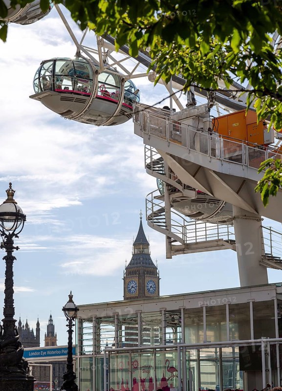 Capsules of the London Eye Ferris wheel with a view of the famous clock tower Big Ben, London, United Kingdom, Europe