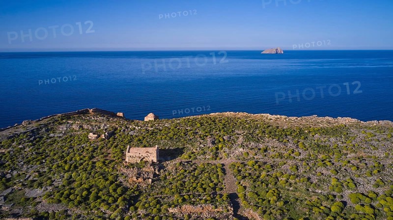 Drone shot, ruins on cliffs by the sea with sweeping views and lush vegetation to the horizon, Venetian sea fortress, Gramvoussa, Gramvoussa peninsula, Pirate Bay, Balos, lagoon, north-west Crete, Crete, Greek Islands, Greece, Europe