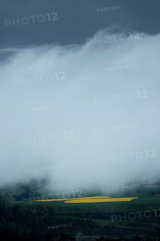 Fields partially obscured by dense fog under a cloudy sky, Wutachschlucht, Buchberg, Blumberg, Baden-Württemberg, Germany, Europe