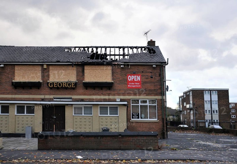 Leeds, England, September 24, 2017: A closed public house stands derelict and boarded on a housing estate in hunslet leeds after being attacked by vandals