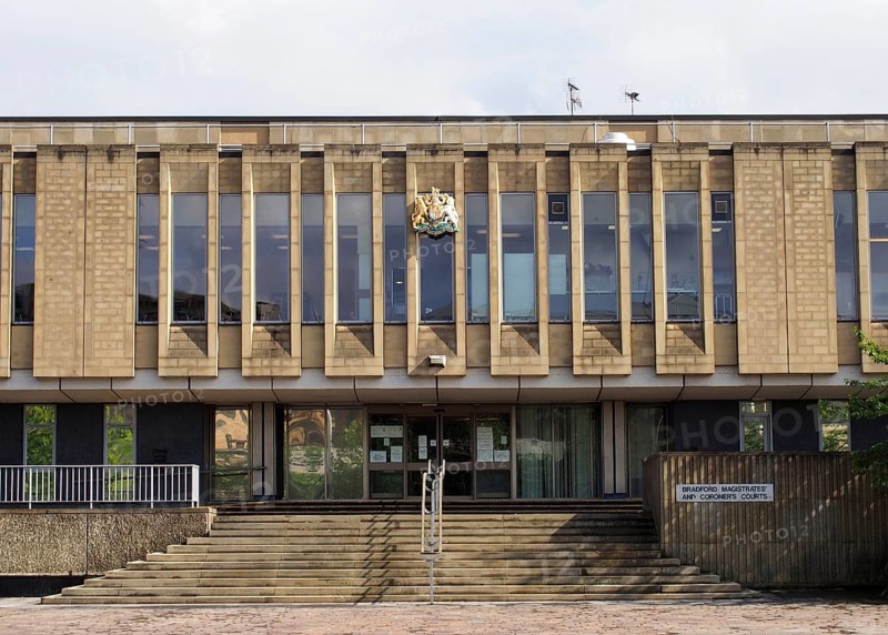 Bradford, west yorkshire, united kingdom, 28 may 2019: pedestrians walk past the front of bradford magistrates court in west yorkshire in centenary square