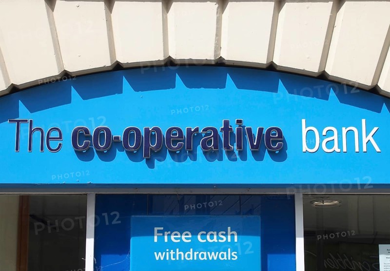 Leeds, west yorkshire, united kingdom, 7 july 2021: sign and logo above the entrance of the co-operative bank on commercial street in leeds city centre
