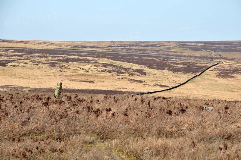 The greenwood stone a historic 16th century boundary marking the borders of midgley and wadworth moor in calderdale west yorkshire surrounded by pennine landscape