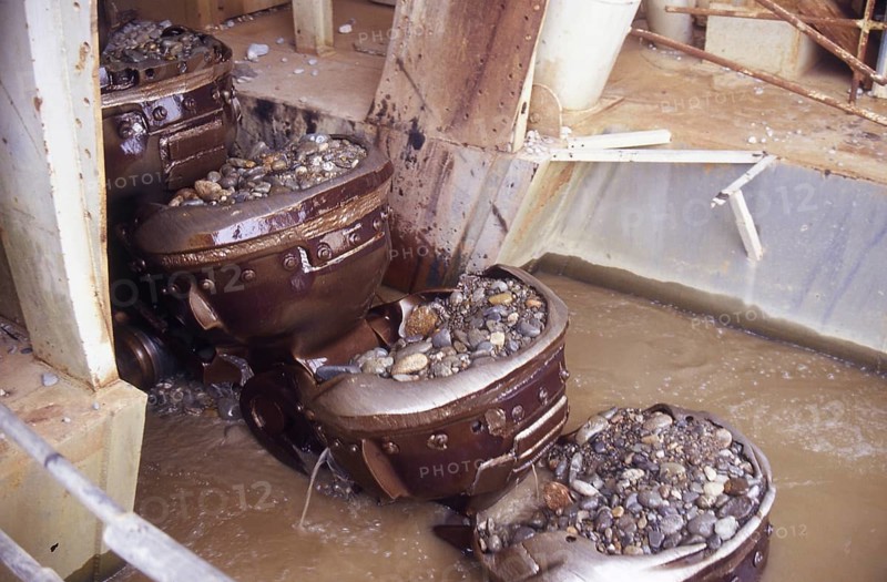 Bucket chain carries river bed gravel into the Ngahere Gold Dredge, West Coast, South Island, New Zealand, Oceania
