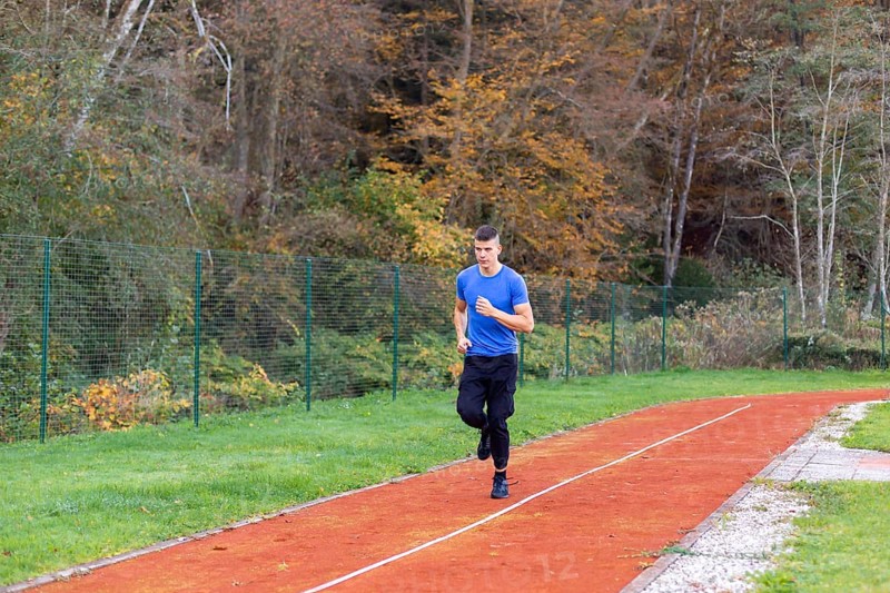 Young man jogging in the morning outdoor on the running race track