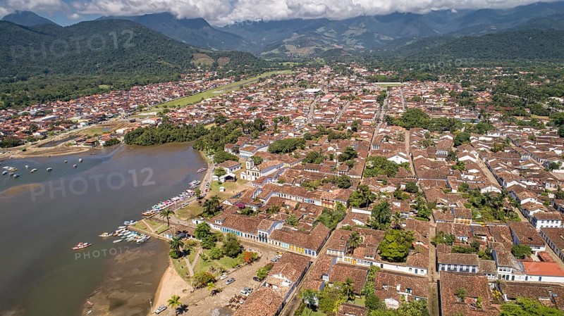 Aerial view to historic town Paraty and harbour, green mountains in background, sunny day, Unesco World Heritage, Brazil, South America