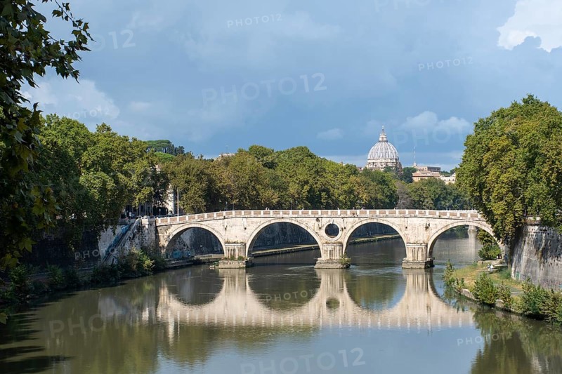 River Tiber and sisto bridge with St Peters in the distance Rome