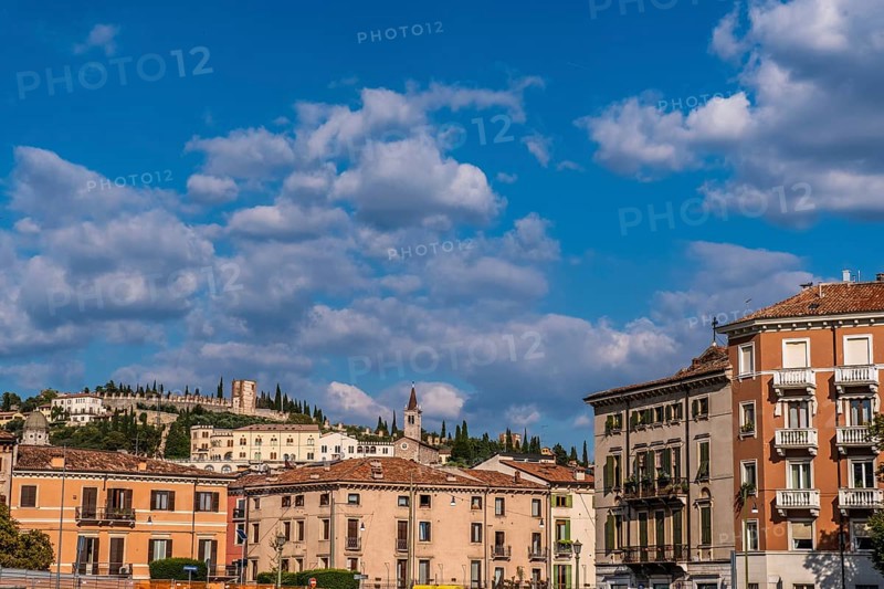 View of Verona historical city centre, Ponte Pietra bridge across Adige river, Verona Cathedral, Duomo di Verona, red tiled roofs, Veneto Region, Italy. Verona cityscape, panoramic view